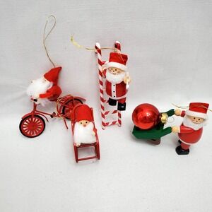 Vintage Avon ☆ 4 PC Frolicking Santa's Red Metal Christmas Ornaments ☆ NIB!